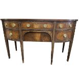 A bowfronted mahogany sideboard, the crossbanded top inlaid with ebony stringing, having