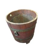 A hardwood bucket log bin by RA Lister & Co Ltd, the staves mounted with three brass bands, having