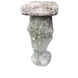 A composition stone sundial base, the square platform top on a tree-trunk moulded column support. (