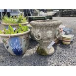 A composition stone urn moulded with rings & lionheads; three glazed garden plantpots; and other