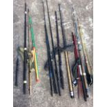 Nine miscellaneous spinning rods - mainly two-piece and some with sleeves; and some other fishing