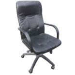 A contemporary office armchair with panelled faux leather upholstery, having shaped arms above an