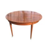 A mahogany dining table, the top with drop-leaf, having plain apron, raised on square tapering