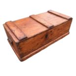 A rectangular dovetailed pine box with battens to top, the ends with carriage handles, raised on