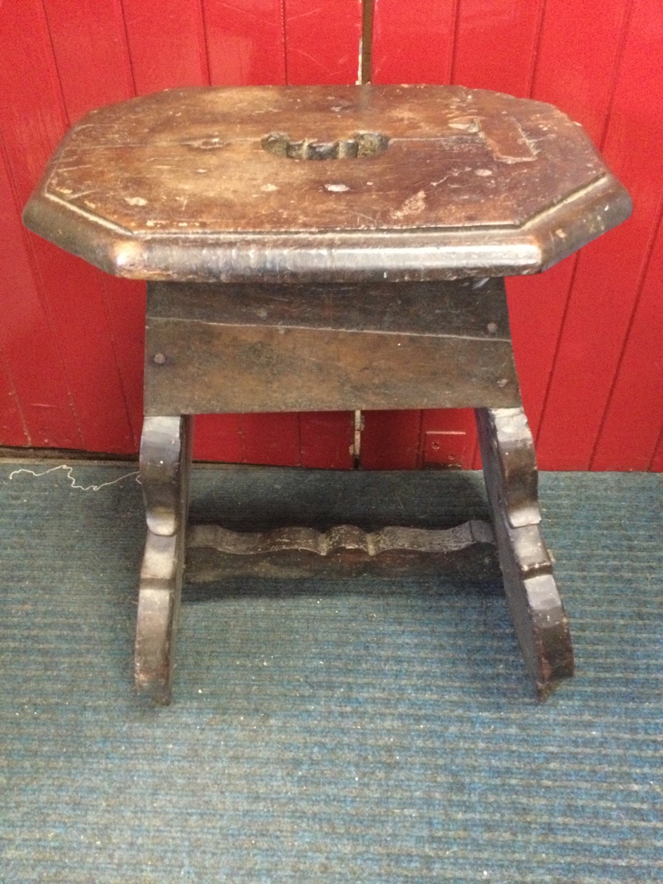 An eighteenth century oak coffin stool, the octagonal top cut with handhold on angled shaped - Image 3 of 3