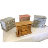 Three miniature painted chests of drawers with shaped aprons; and another in the style of a Scotch