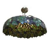 A Tiffany style leaded glass light enclosure of inverted bowl shape, designed with leaves and