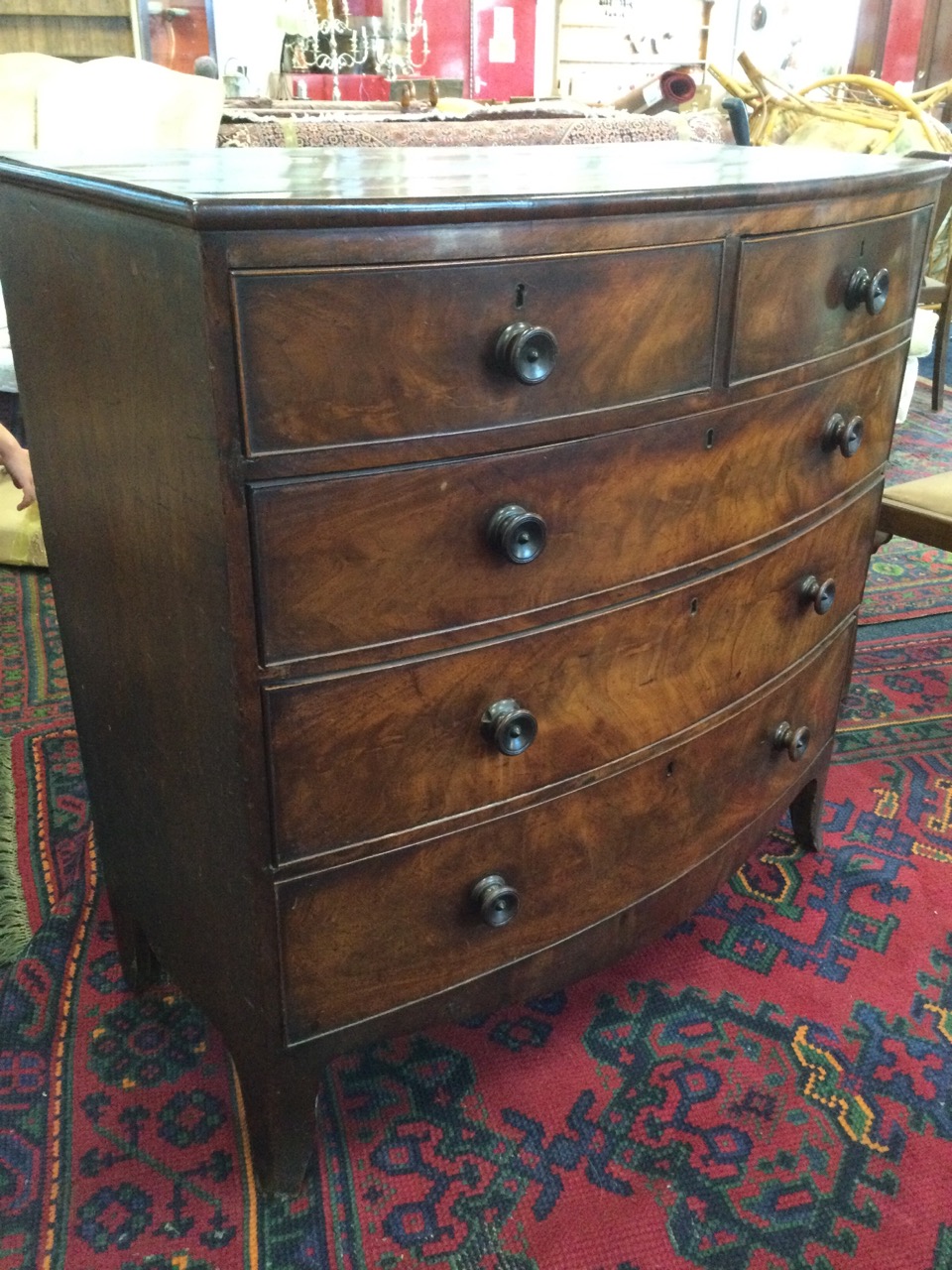 A nineteenth century bowfronted mahogany chest of drawers, with two short and three long graduated - Image 2 of 3