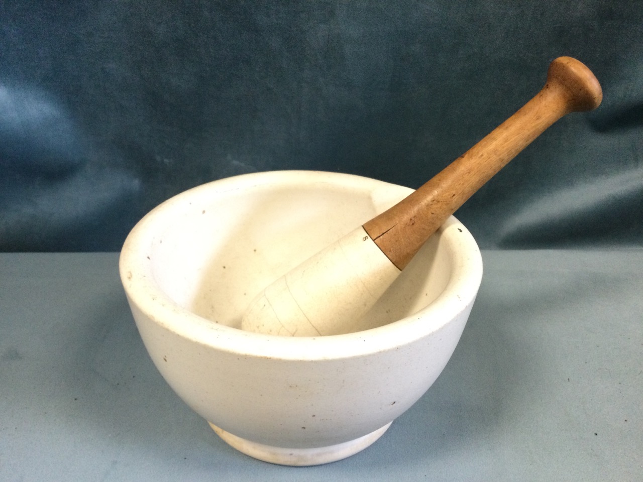 A large Edwardian pestle & mortar, the bowl with shaped spout, the pestle handle of turned