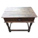An eighteenth century oak box table, the rectangular plank top above a dowel jointed box with fluted