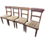 A set of four Victorian mahogany dining chairs with shaped backs above studded stuffover upholstered