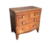 A nineteenth century mahogany chest of drawers, the rectangular top with ribbed edge above two short