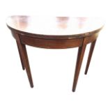 An antique D shaped mahogany card table, the top with baize lined interior above a boxwood & ebony