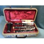 A cased Corton clarinet, the numbered instrument with spare reeds, cleaning tools, etc. - B07074.