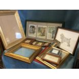 A box of miscellaneous gilt frames, a set of three miniature floral framed fabric prints, unused