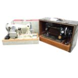 A cased Elmwood sewing machine; and another in crocodile style case by Singer. (2)