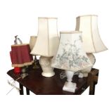 A quantity of tablelamps including a pair with hexagonal shades on urn moulded bodies embossed