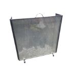 A large contemporary folding sparkguard with wire mesh panels, having central handle. (45in x 31in)