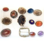 Twelve oval Victorian cabochon shaped brooches & pendants, silver & yellow metal, amber, polished
