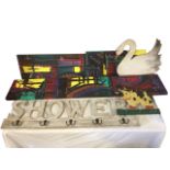 A painted peg-rack with shower fretwork; another with painted cow; three rectangular abstract