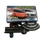 A boxed Scalextric set, Total Supercars with Lamborghini Vs Audi, together with a quantity of