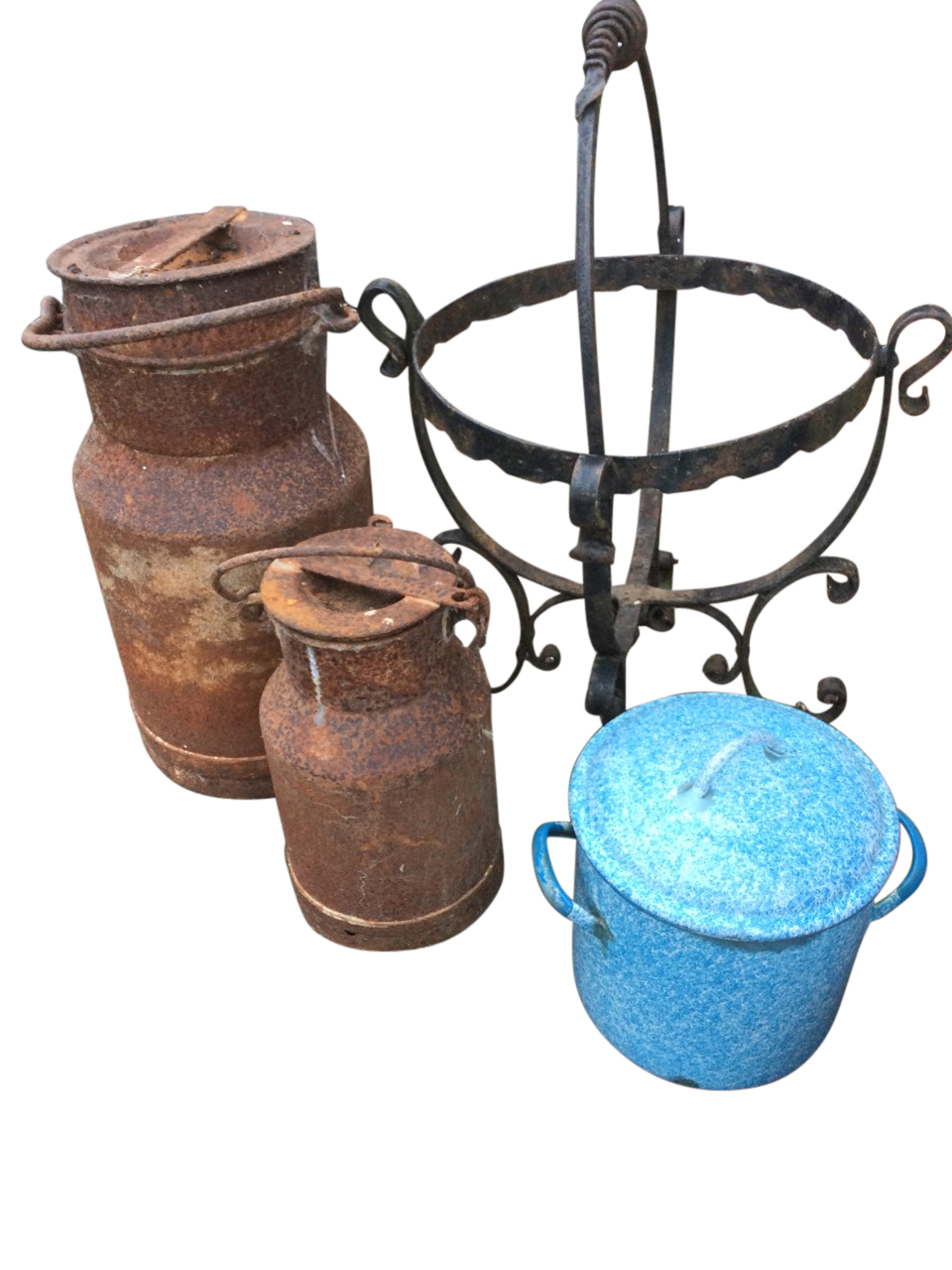 A graduated pair of ancient milk churns & covers with swing handles; a circular wrought iron pot