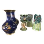 A pair of Carlton Ware vases enamelled with chinoiserie birds, pagodas, figures and bridge on blue