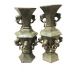 A pair antique hexagonal eastern vases carved from serpentine type stone, overall engraved with