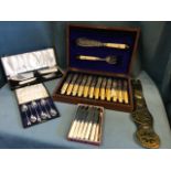 A walnut cased monogrammed twelve piece fish service with servers, having ivory handles and leaf
