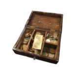 An oak box of coins, the panel lid inlaid with leaf decoration, the coins mainly GB copper & silver.