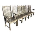 A set of six Bridgman teak garden chairs with two carvers, having arched back rails above slatted
