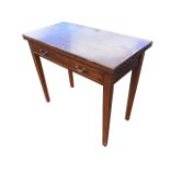 A nineteenth century mahogany turn-over-top tea table, the rectangular twin top above a frieze