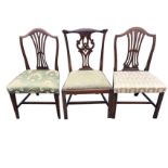 Three antique mahogany dining chairs - two Hepplewhite style with shield shaped backs and pierced
