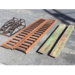 A pair of 7ft welded angleiron ribbed ramps for 12in tyres; a pair of 5ft 6in forklift extensions;