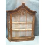 A Queen Anne style walnut miniature display cabinet with carved arched moulded cornice above an