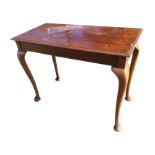 A late Victorian mahogany centre table, the rectangular moulded top above a plain frieze, raised