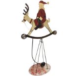 A large 6ft 8in tall metal Father Christmas display rocking reindeer, the weighted figure with