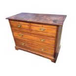 A late Victorian walnut chest of drawers with rectangular top above two short and two long ribbed