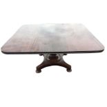 A large nineteenth century walnut breakfast table, the rectangular top with moulded edge raised on