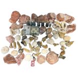 A box of miscellaneous geological specimens including open/broken geodes, polished stones, shells,
