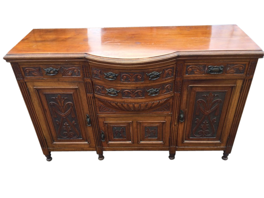 A Victorian carved walnut sideboard, the bowfronted central section with two drawers above a
