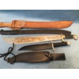 A contemporary Cuban sheathed machete, with steel blade and decorative tooling to leather; another
