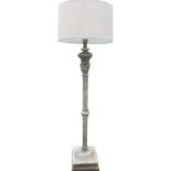 A verdigris metal standard lamp with column on square plinth base with scrolled fretwork, supporting