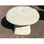A composition mushroom shaped staddlestone, with domed cover on square tapering column base. (23in x