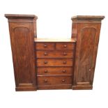 A nineteenth century mahogany sentrybox wardrobe, with pair of arched panelled door hanging
