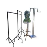 An adjustable dress makers mannequin; a clothes display stand; and three miscellaneous clothes