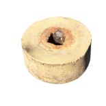 A wide sandstone grinding wheel with central square aperture. (6.5in x 15in)