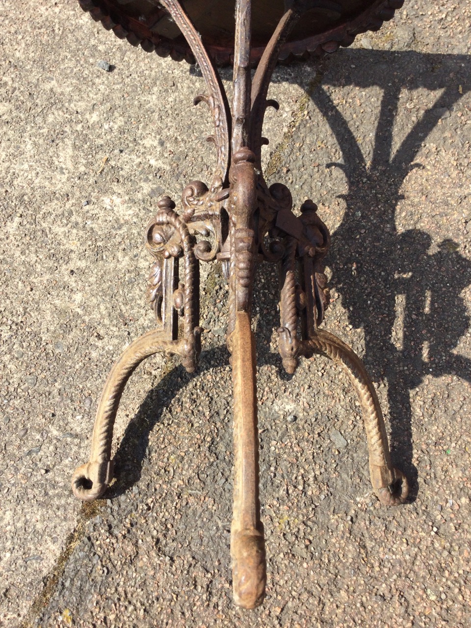 A circular Victorian cast iron table with ropetwist cast tripod legs centered by a scrolled urn, the - Image 2 of 3