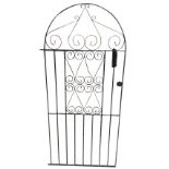 An arched wrought iron garden gate with scrolled decoration to central panel. (32in x 72.25in)