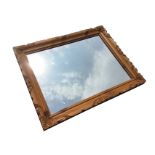 A contemporary rectangular pine mirror in moulded carved frame. (24.75in x 31in ext)